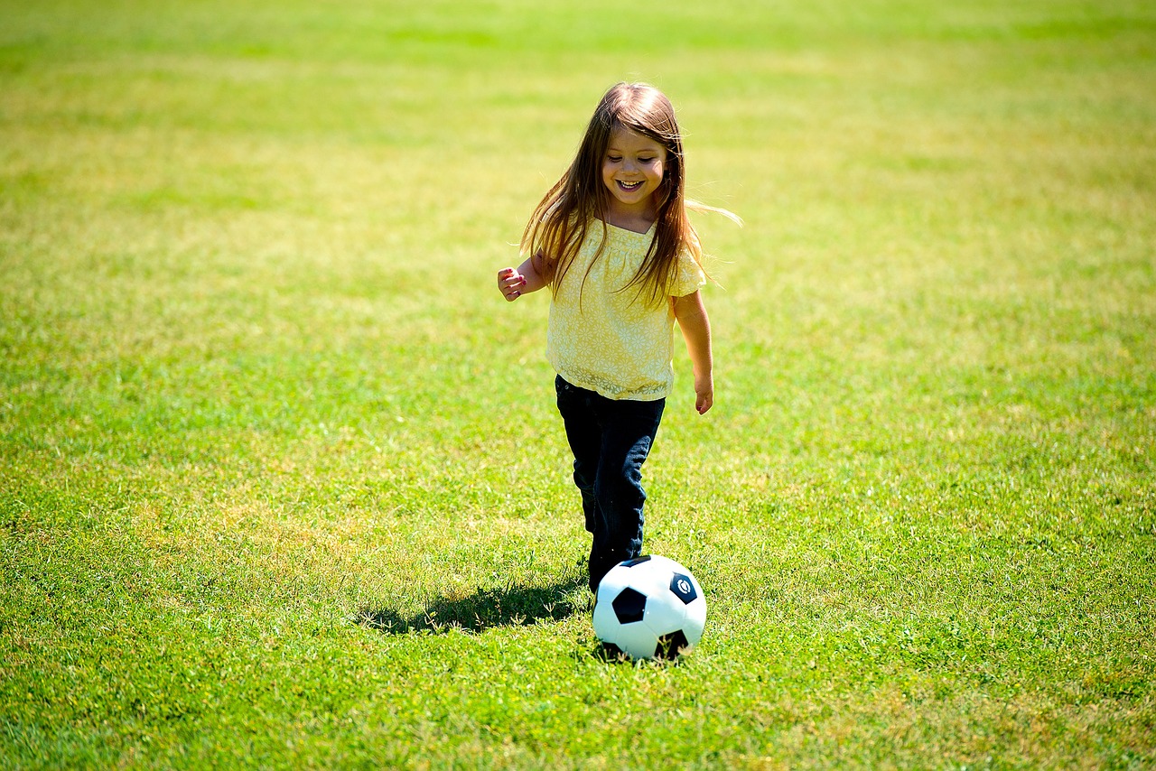 Image - girl playing soccer ball happy