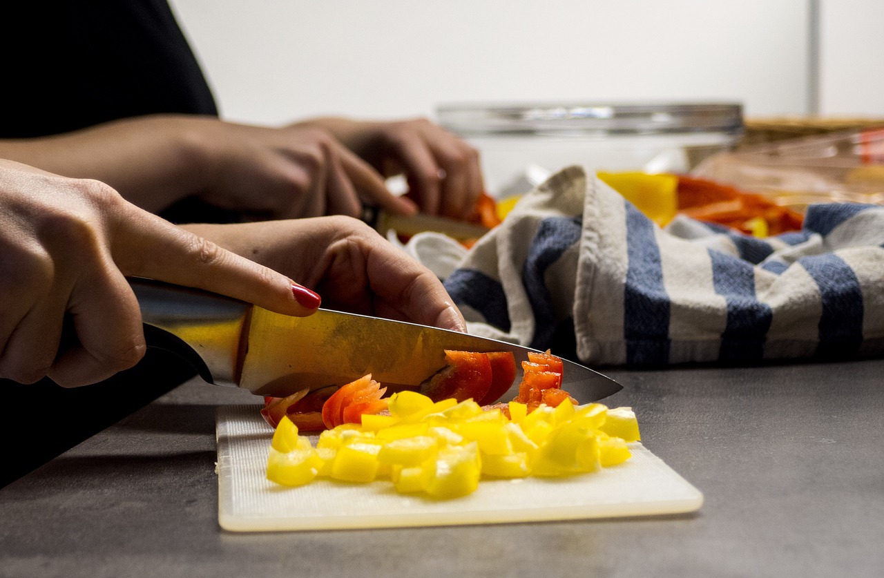 Image - woman hands cutting vegetables