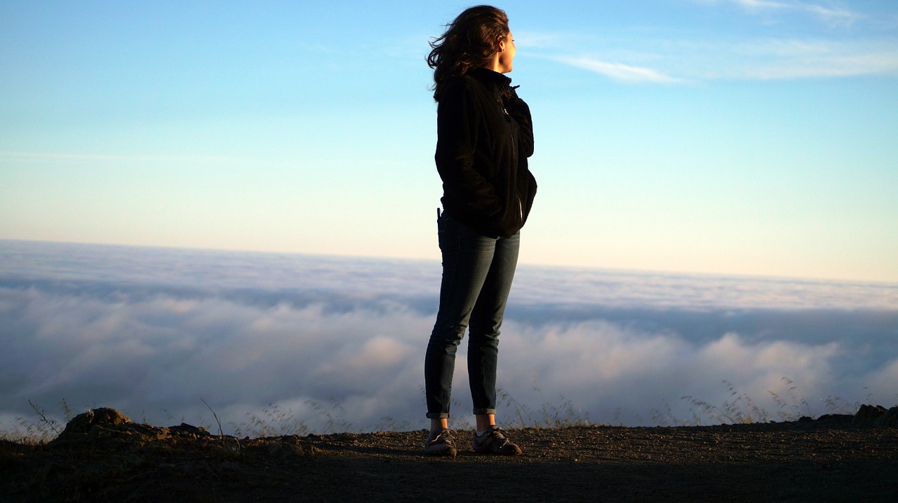 Image - woman heights clouds success