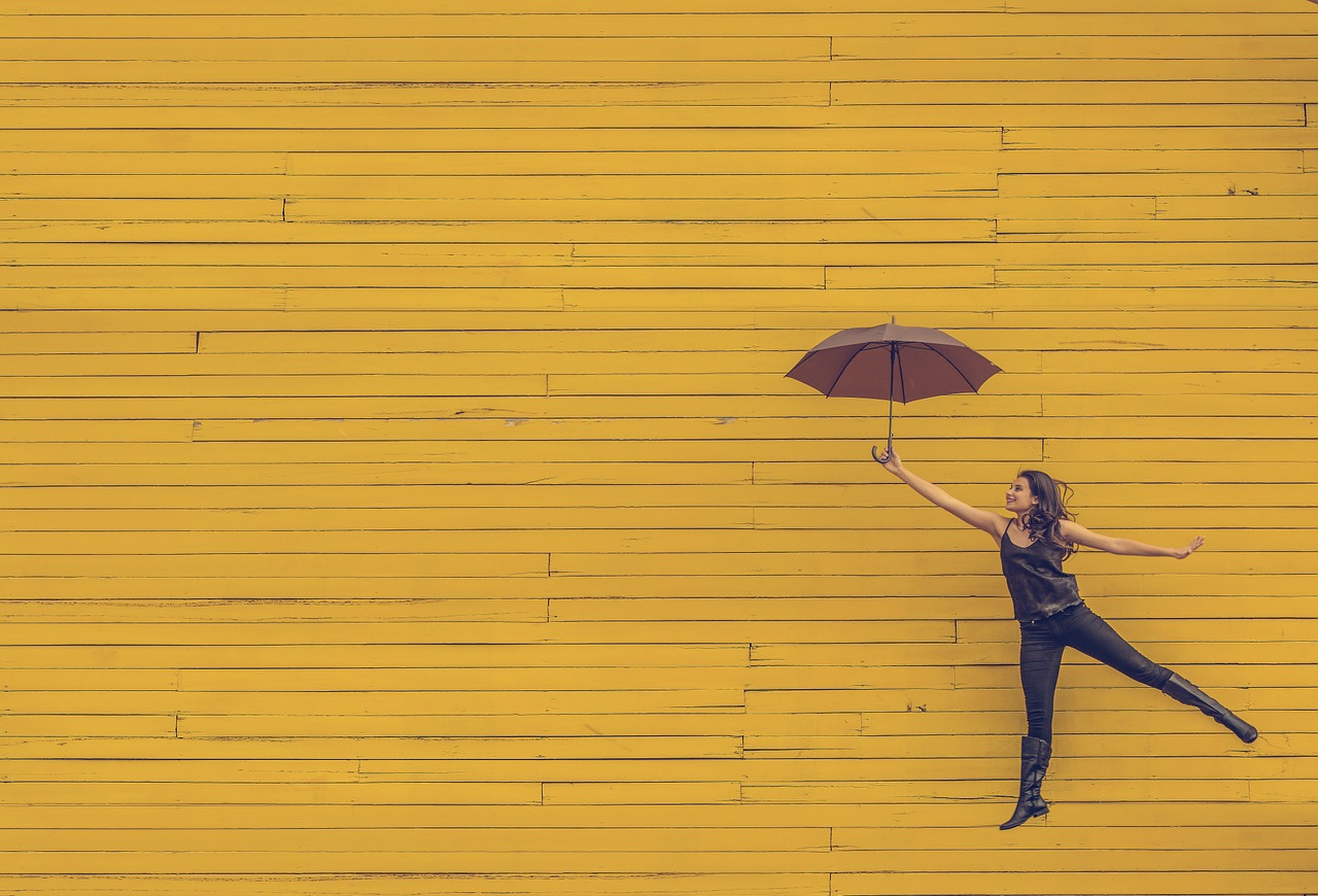 Image - woman umbrella floating jumping