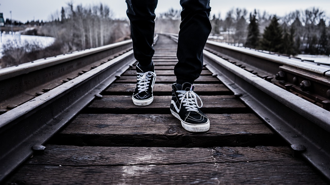 Image - shoes walking railroad tracks