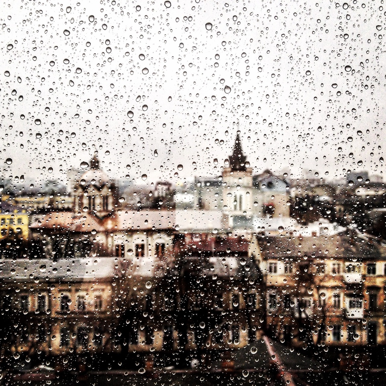 Image - rainy day cityscape window pane