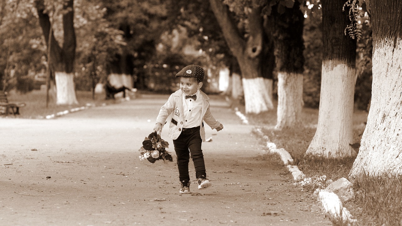 Image - boy child bouquet flowers park