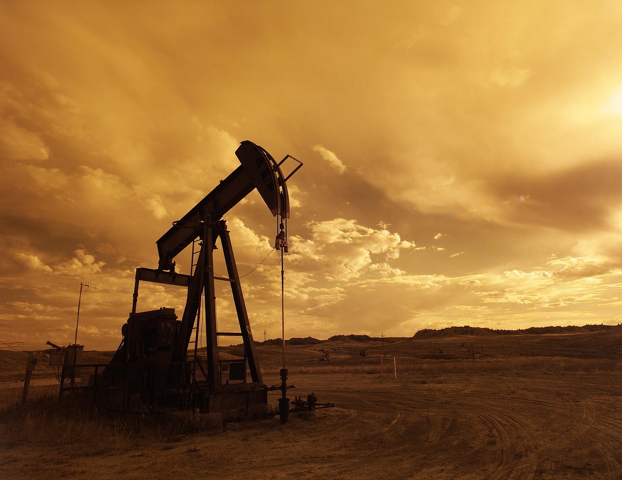 Image - oil pump jack sunset clouds