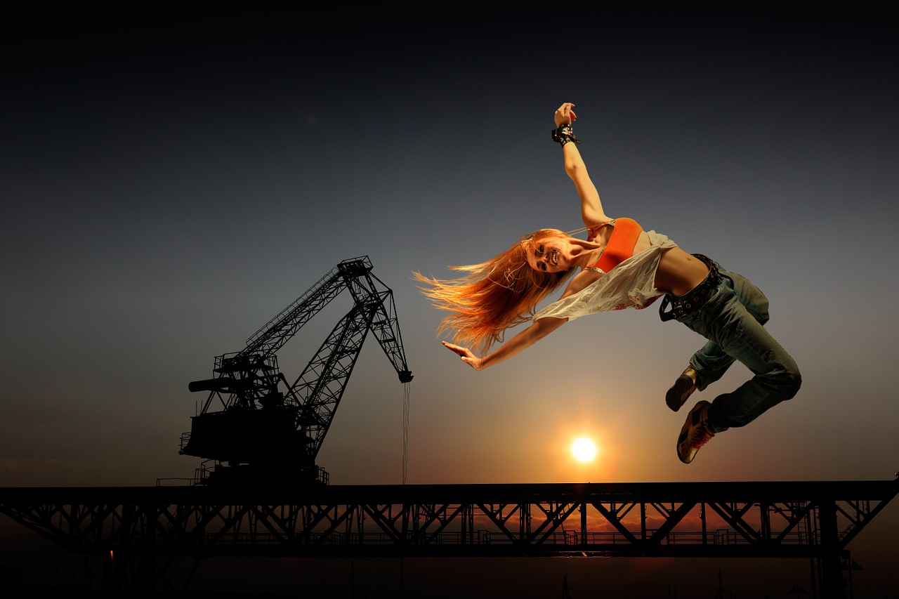Image - joyful leap woman jeans acrobatics