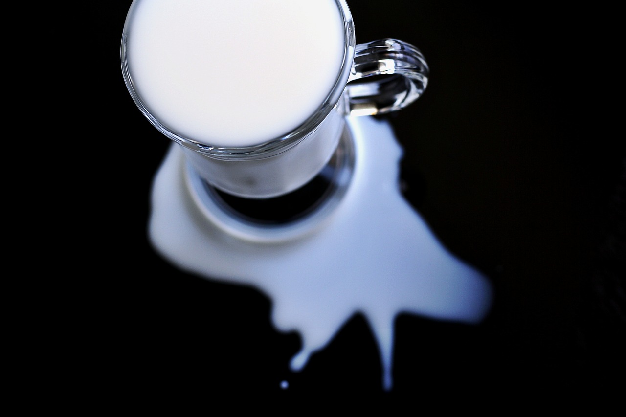 Image - milk spilt white glass spill