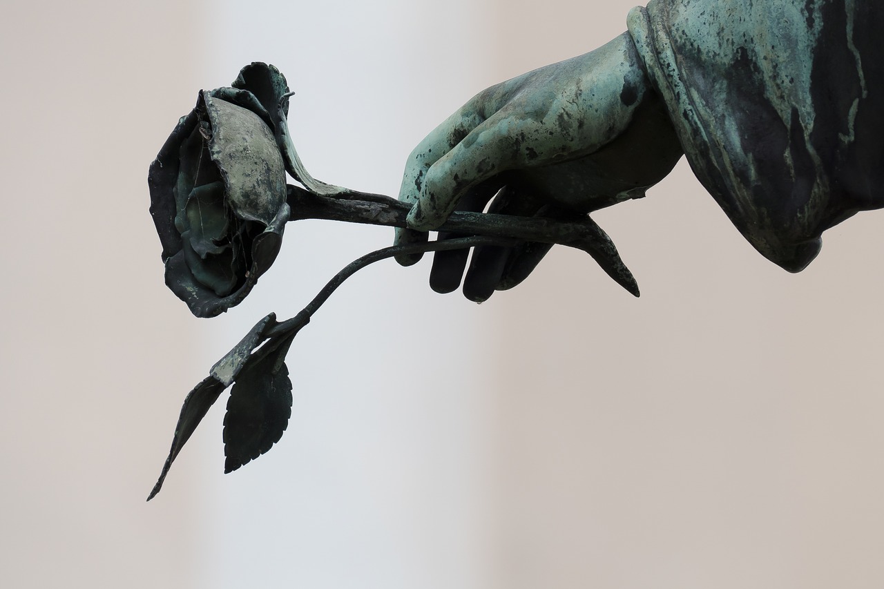 Image - angel hand rose cemetery sculpture