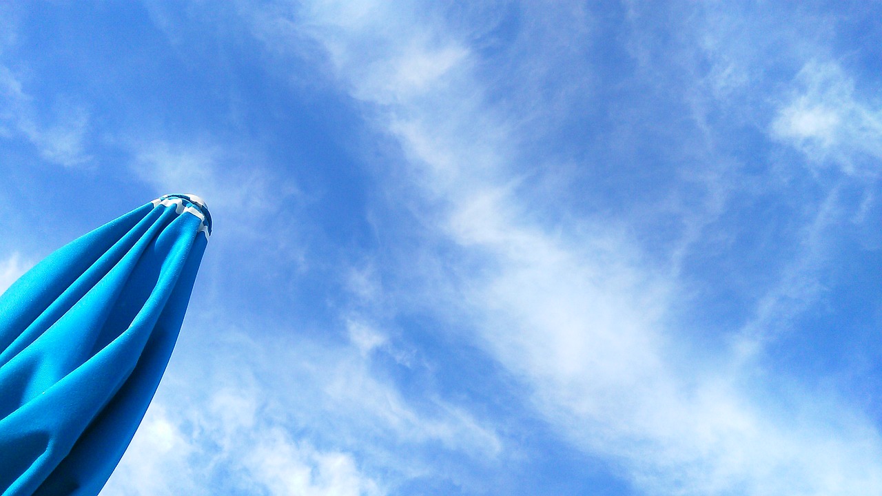 Image - sky clouds beach umbrella beach