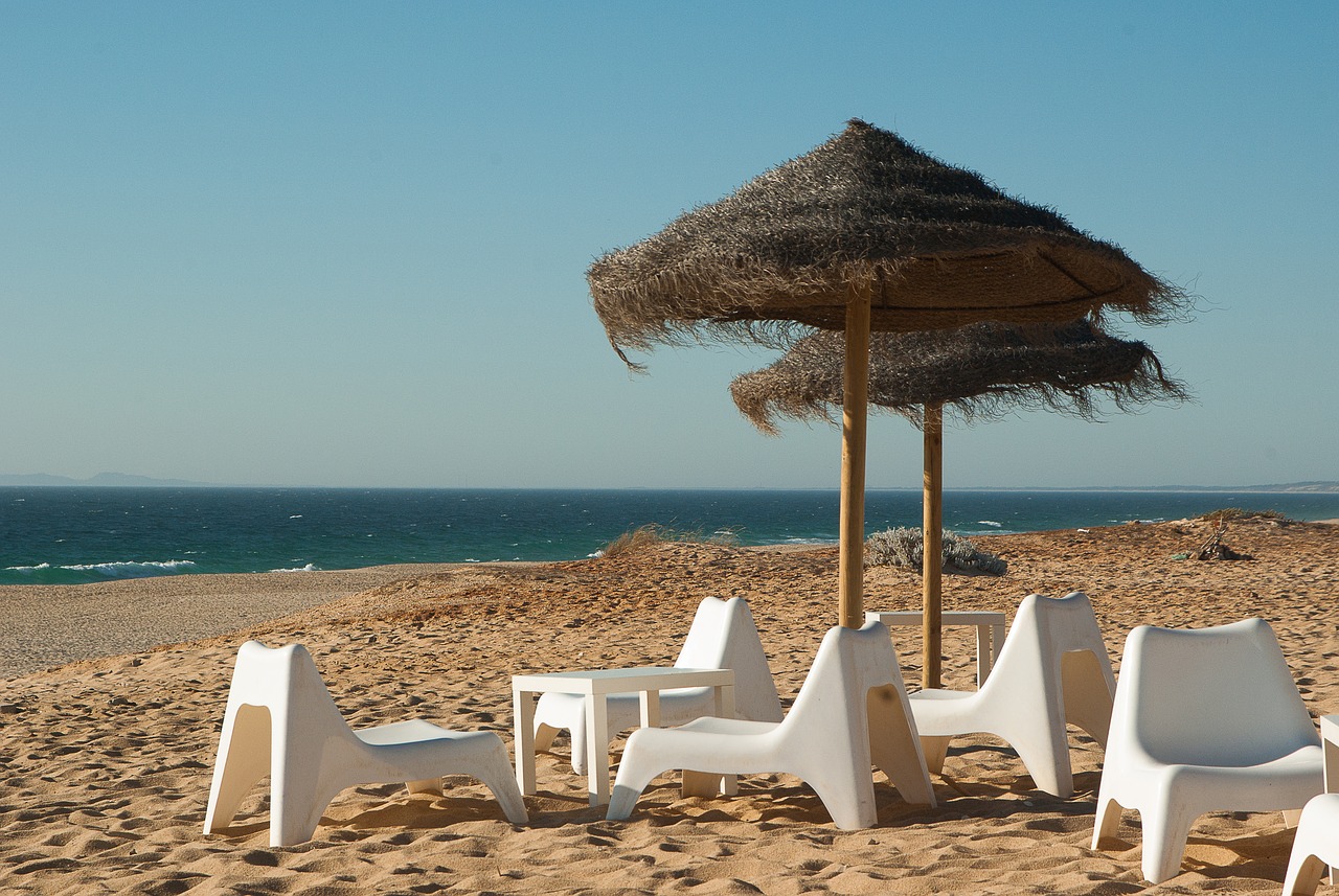 Image - beach parasols beach chairs