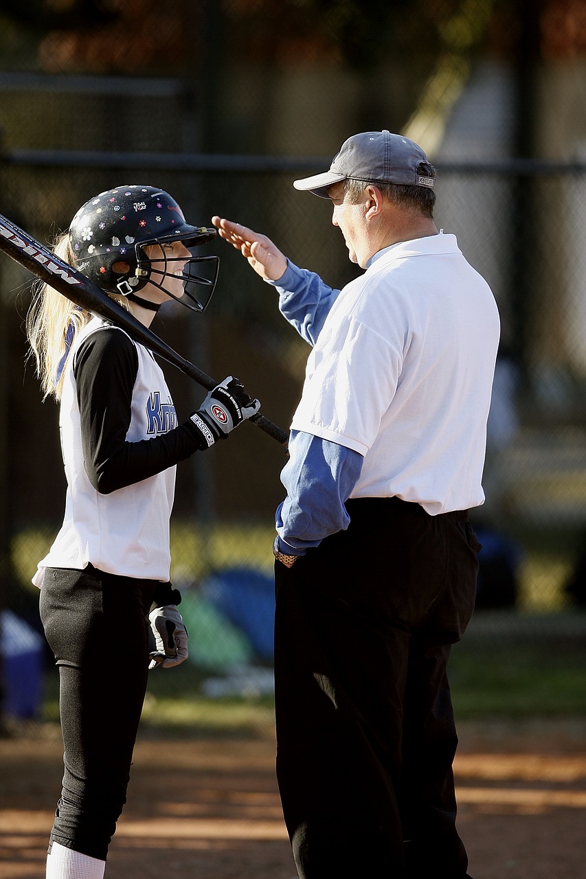 Image - softball coach coaching player