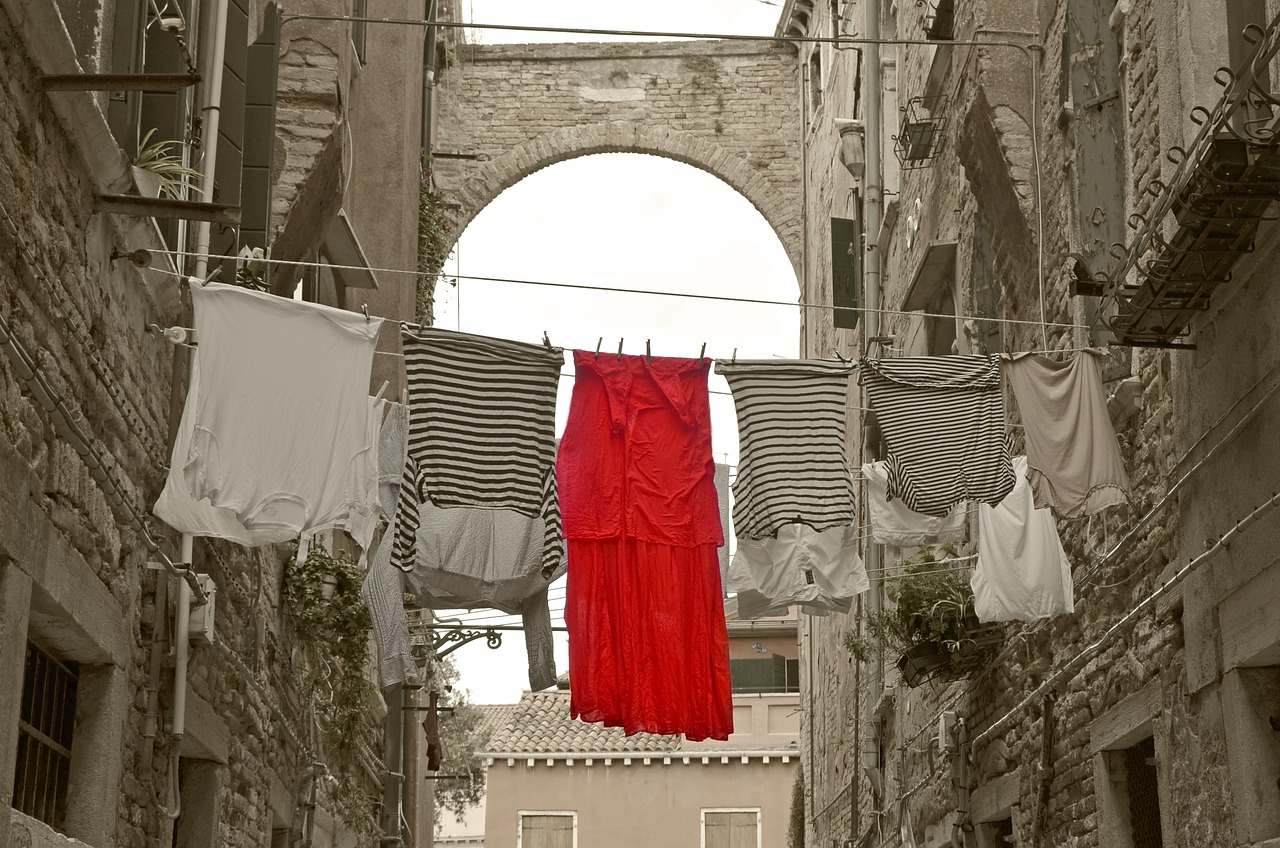 Image - red dress alley venice clothes line