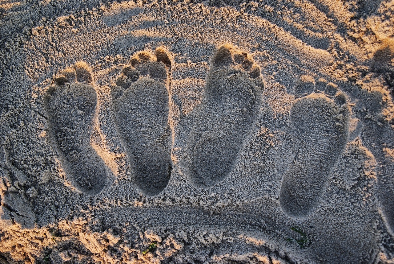 Image - footprints beach light sand sun