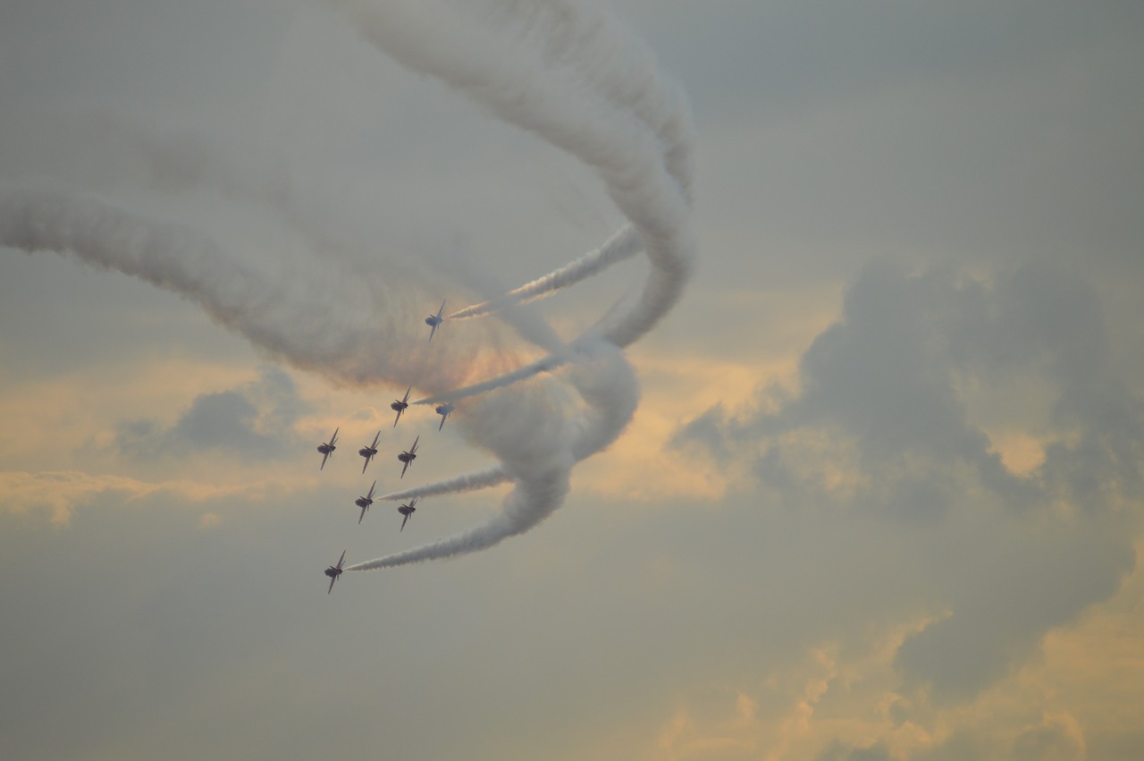 Image - smoke trails red arrows stormy