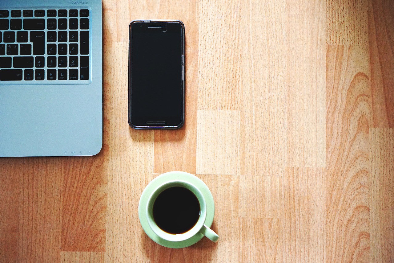 Image - office phone coffee table laptop