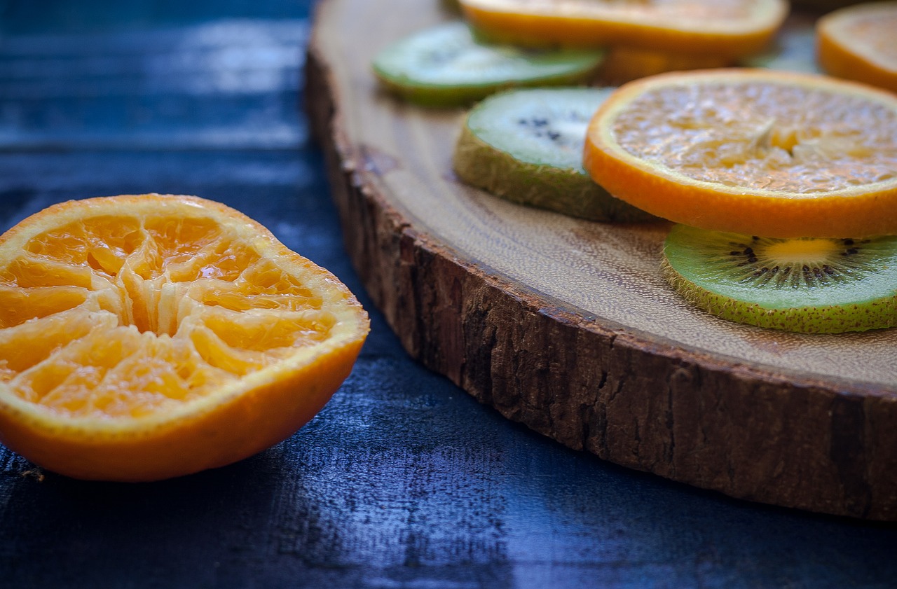 Image - orange kiwi wood table blue green