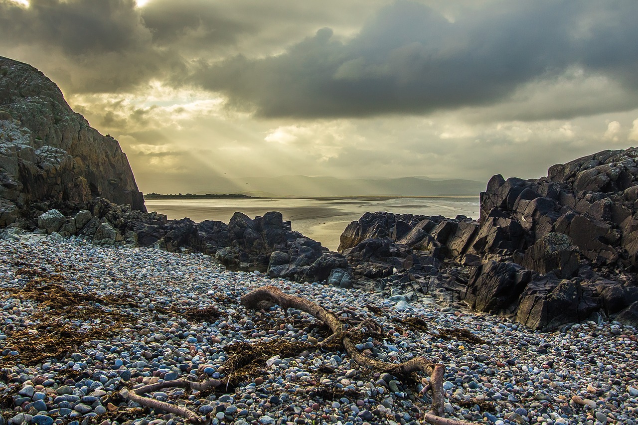 Image - sun rays rocks beach ocean coast