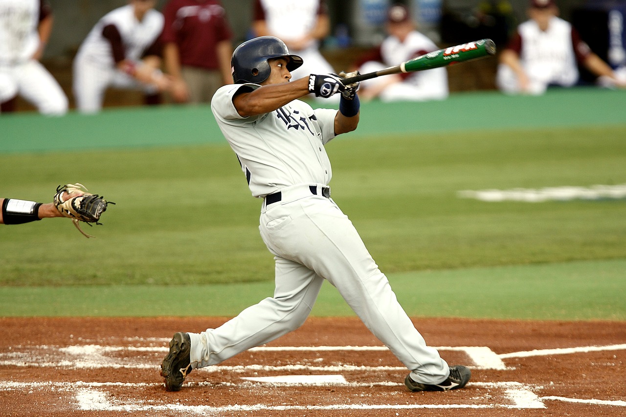 Image - baseball batter swinging strike