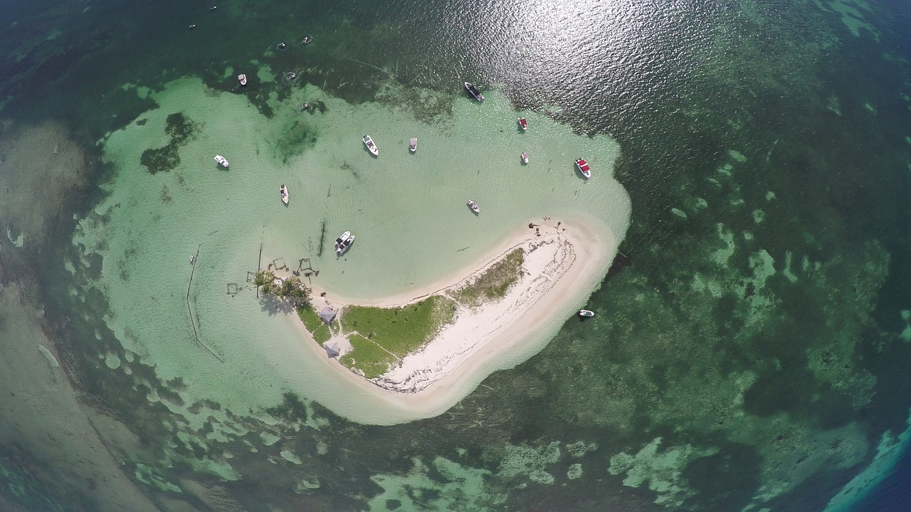 Image - islet beach sand sky air boat