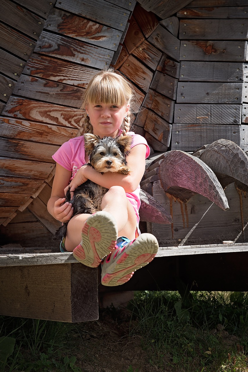 Image - child girl blond dog small dog