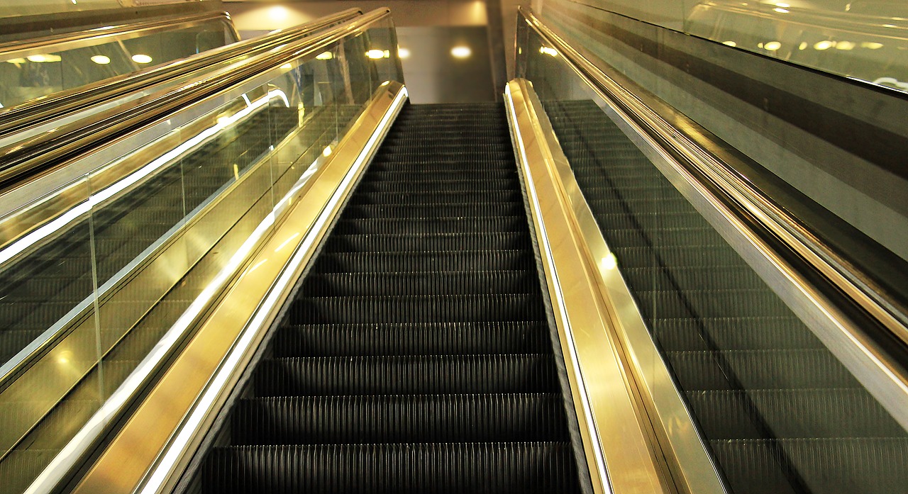 Image - escalator mirroring upward