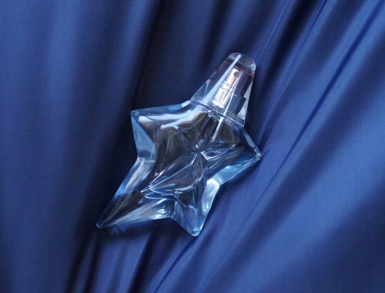 Image - perfume aroma bottle blue surface