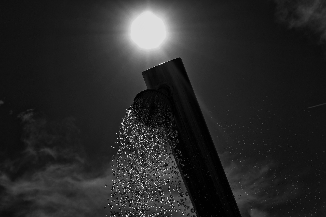 Image - beach shower sun sky clouds water