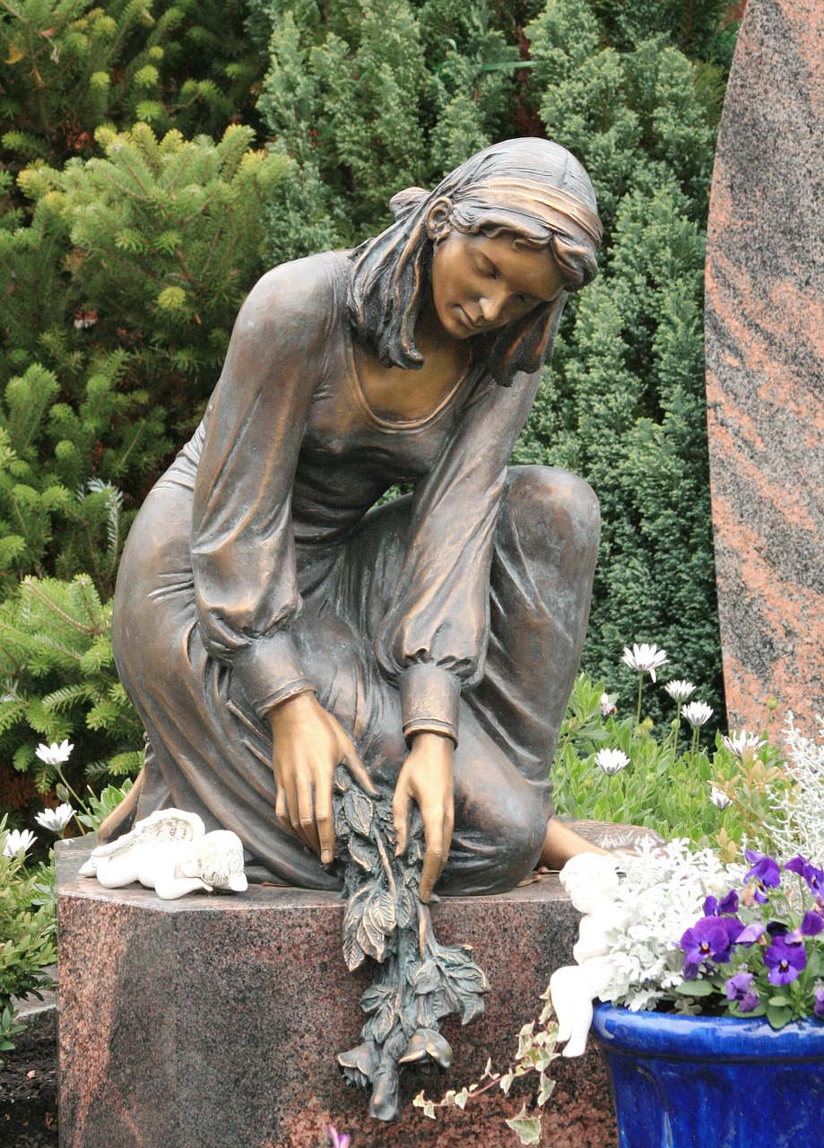 Image - woman mourning sad face cemetery