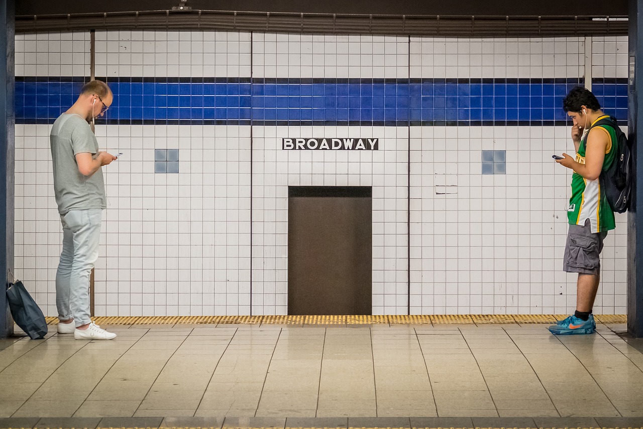 Image - broadway station phone men subway