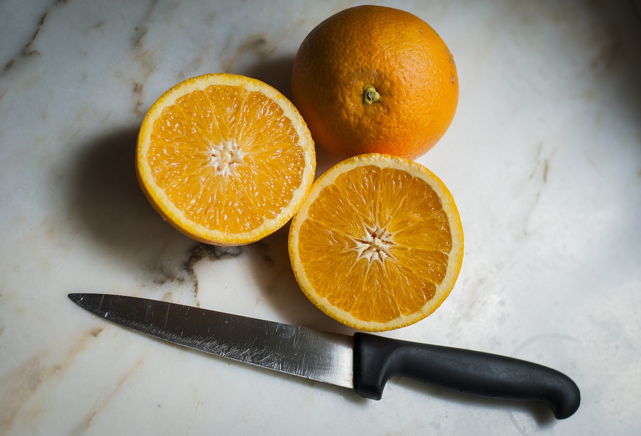 Image - orange fruit table knife juice