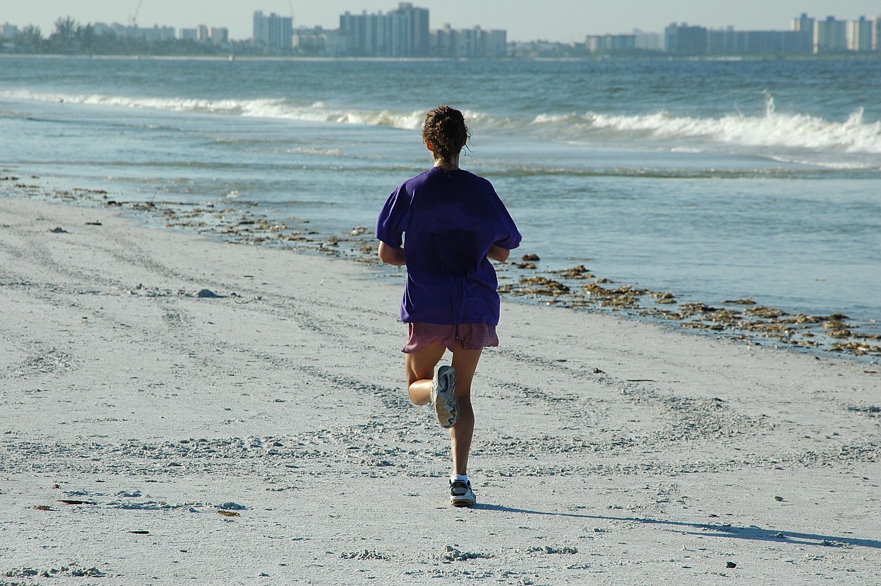 Image - woman jogger jogging beach ocean