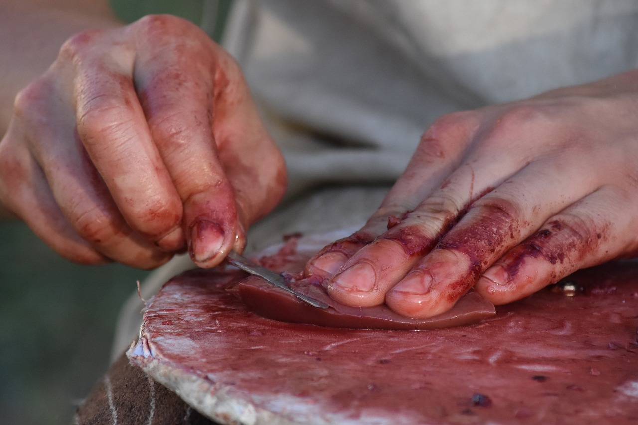 Image - cutting meat hands blood staples