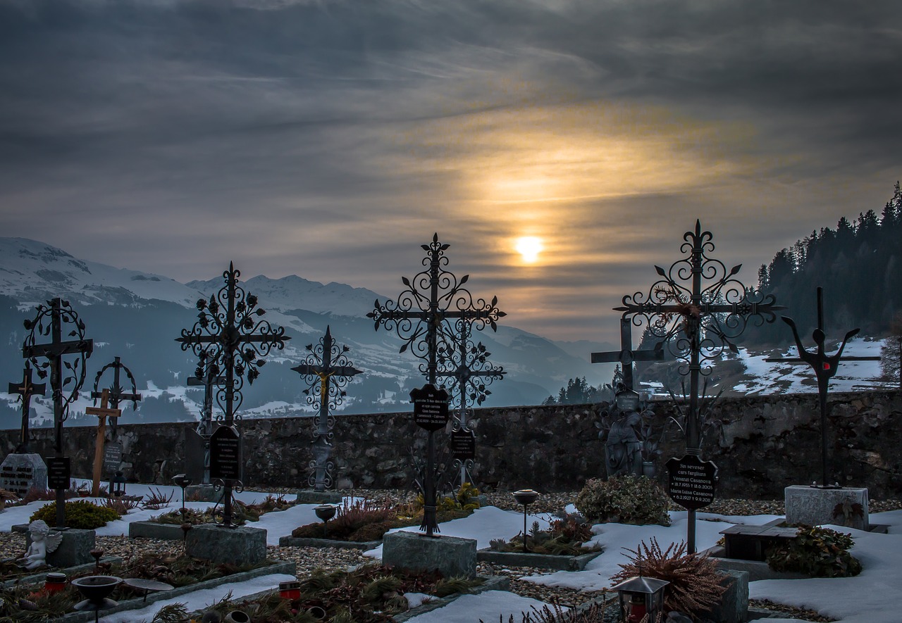 Image - cemetery sunset snow mountains