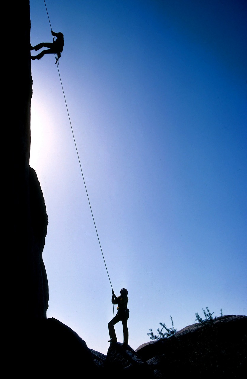 Image - rock climbers teamwork summit peak