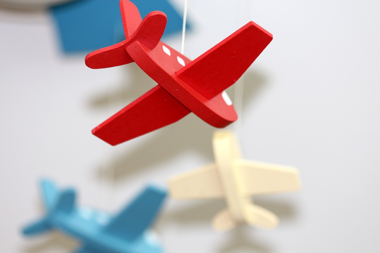 Image - plane toys red light background