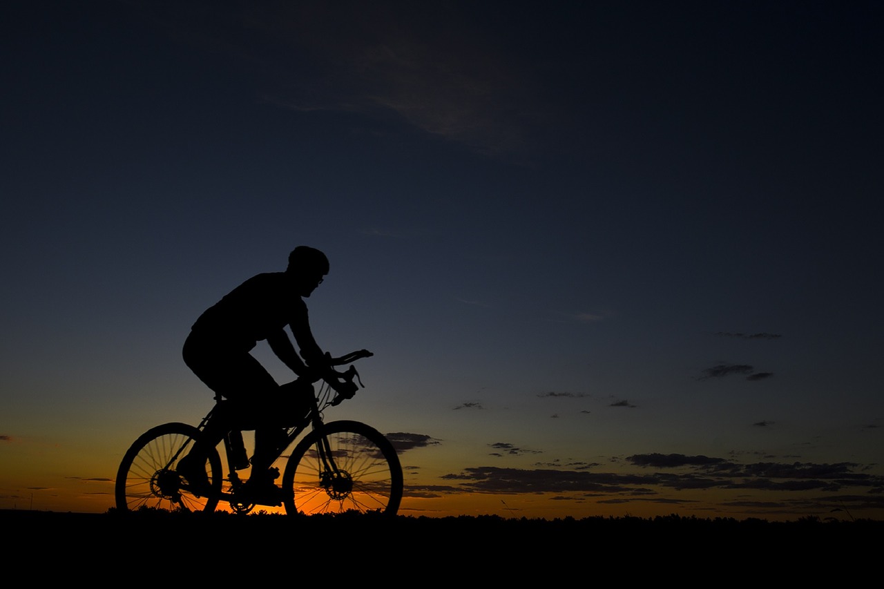 Image - bicycle rider riding bike sunset