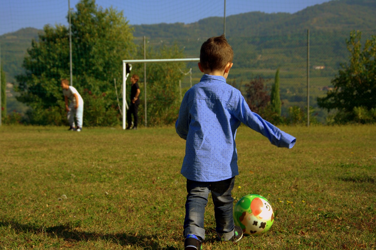 Image - child football player ball