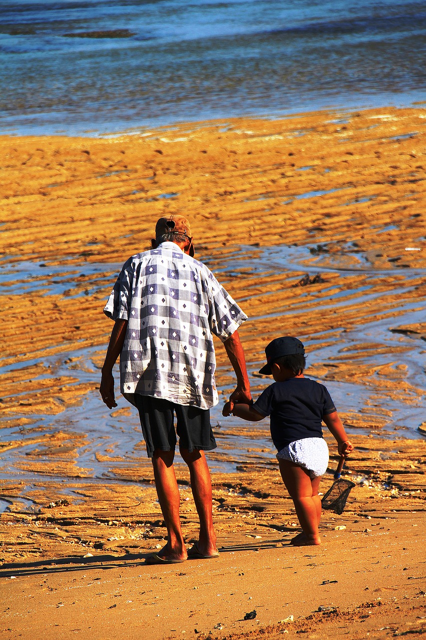 Image - bali grandfather grandson sand