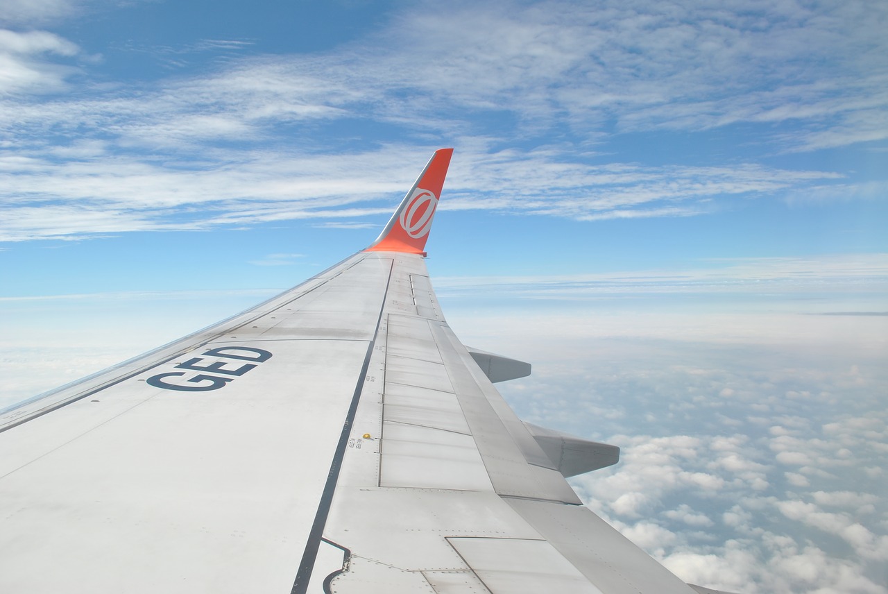 Image - clouds wing plane travel