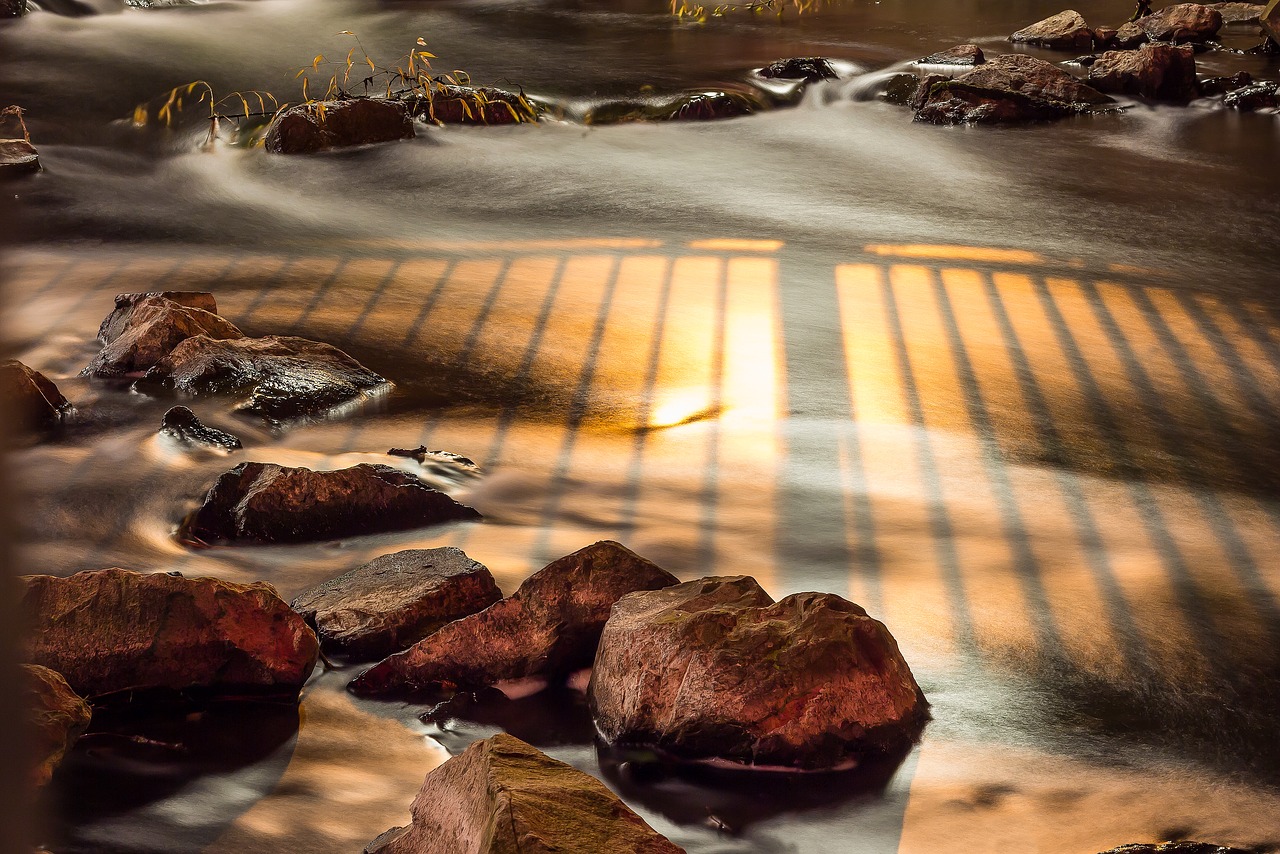 Image - river illuminated bach stones