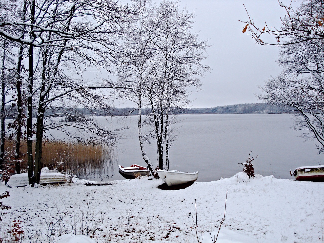 Image - wintry sweden lake boats ashore