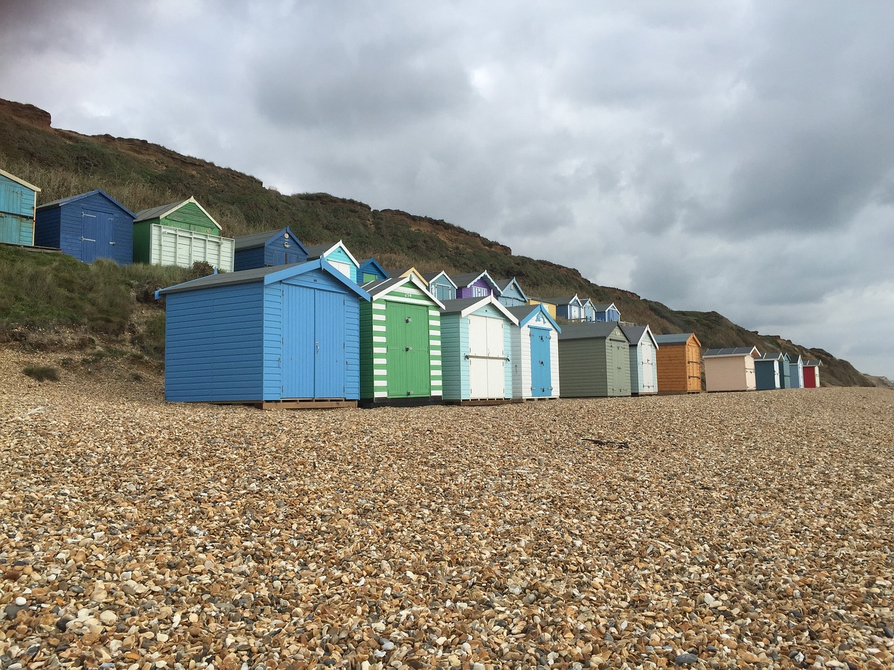 Image - beach huts beach pebbles moody