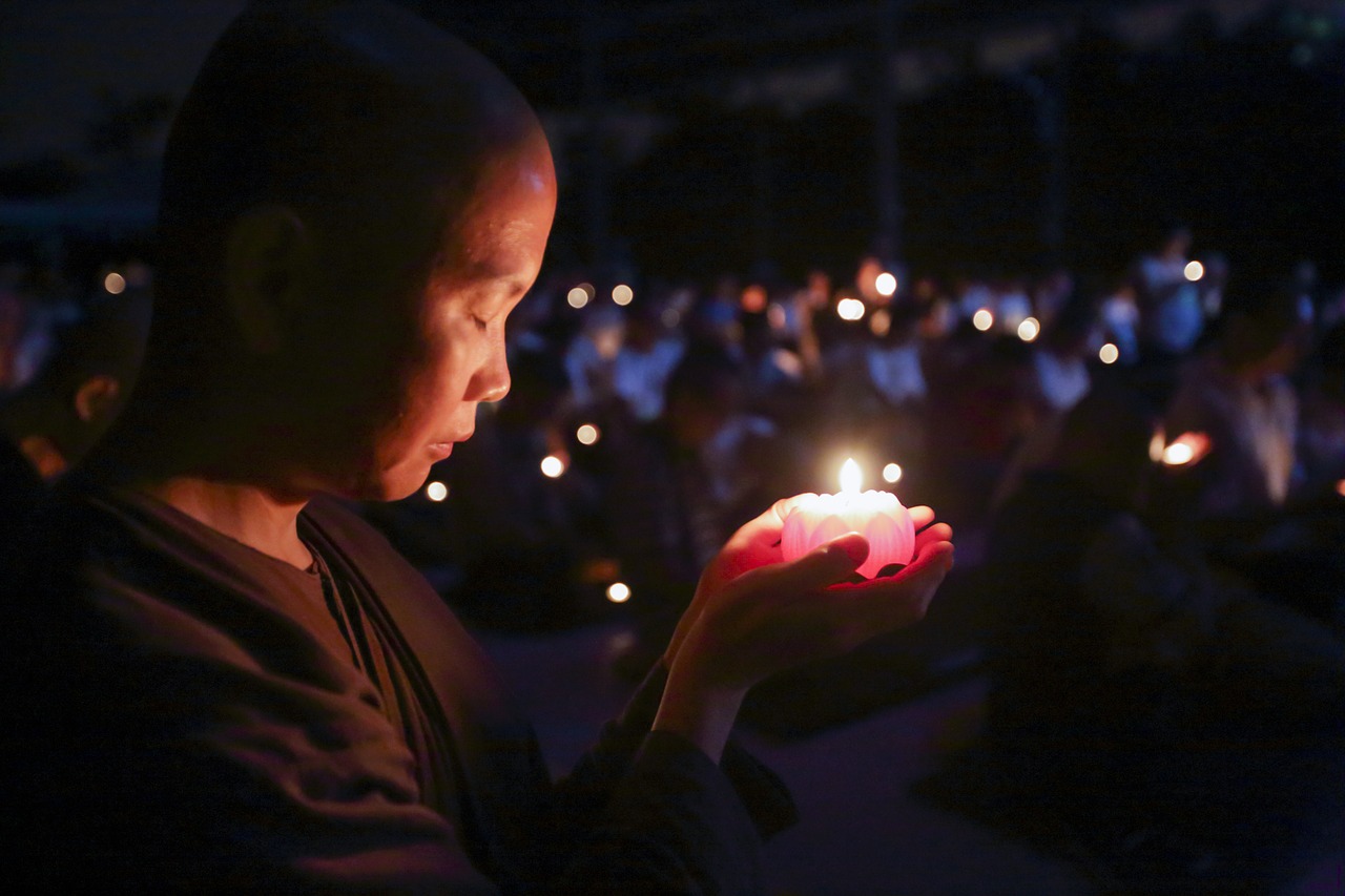 Image - nun with candle theravada buddhism