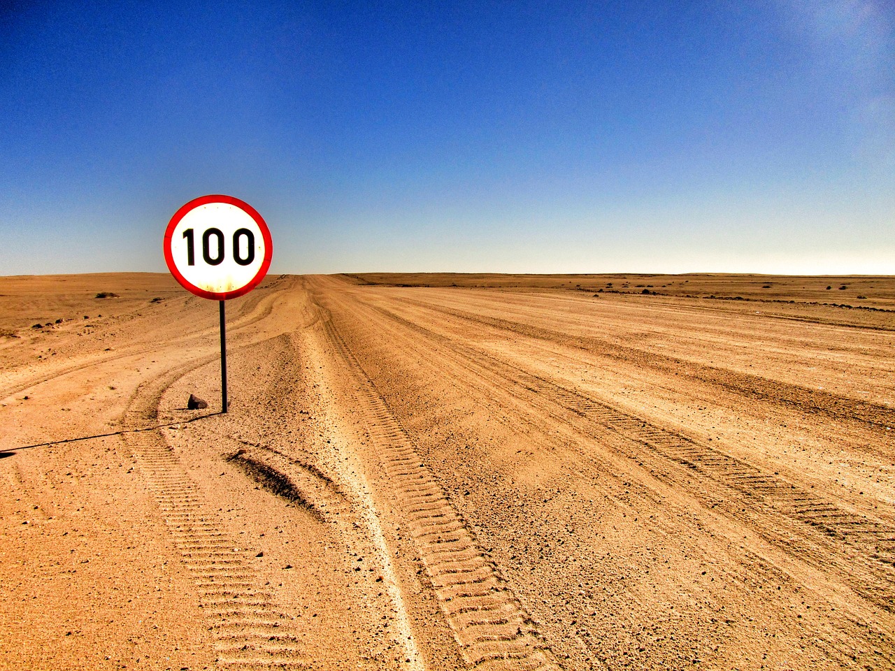 Image - desert road sand sign sky
