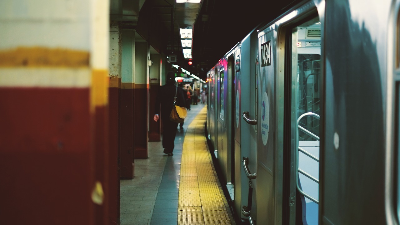 Image - commuters people railway train