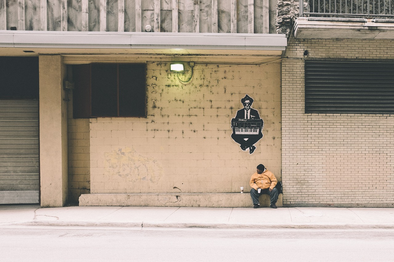 Image - building man pavement person