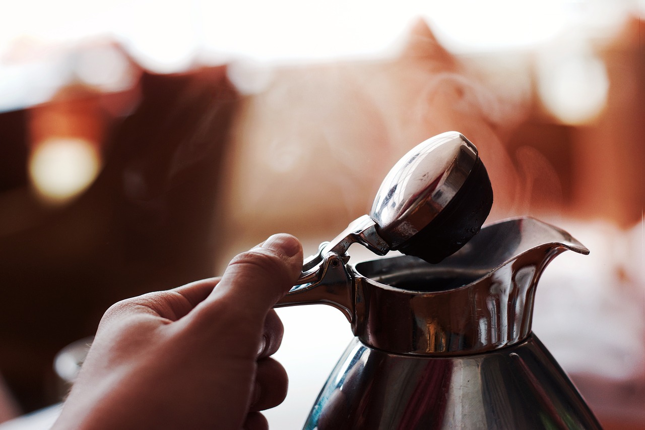 Image - hand hot kettle macro