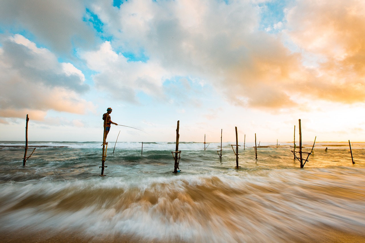 Image - beach clouds fishing man ocean