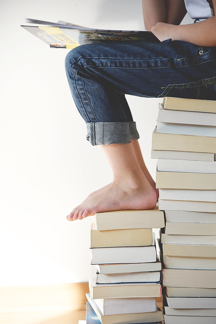 Image - books feet legs person reading