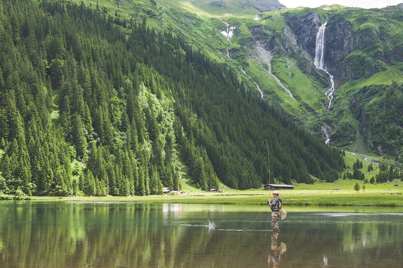 Image - fisherman fishing grass hill