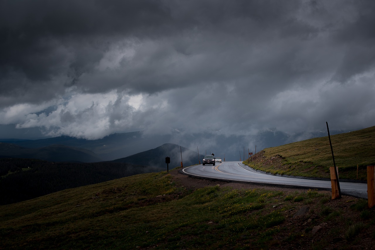 Image - cars clouds foggy grass hill